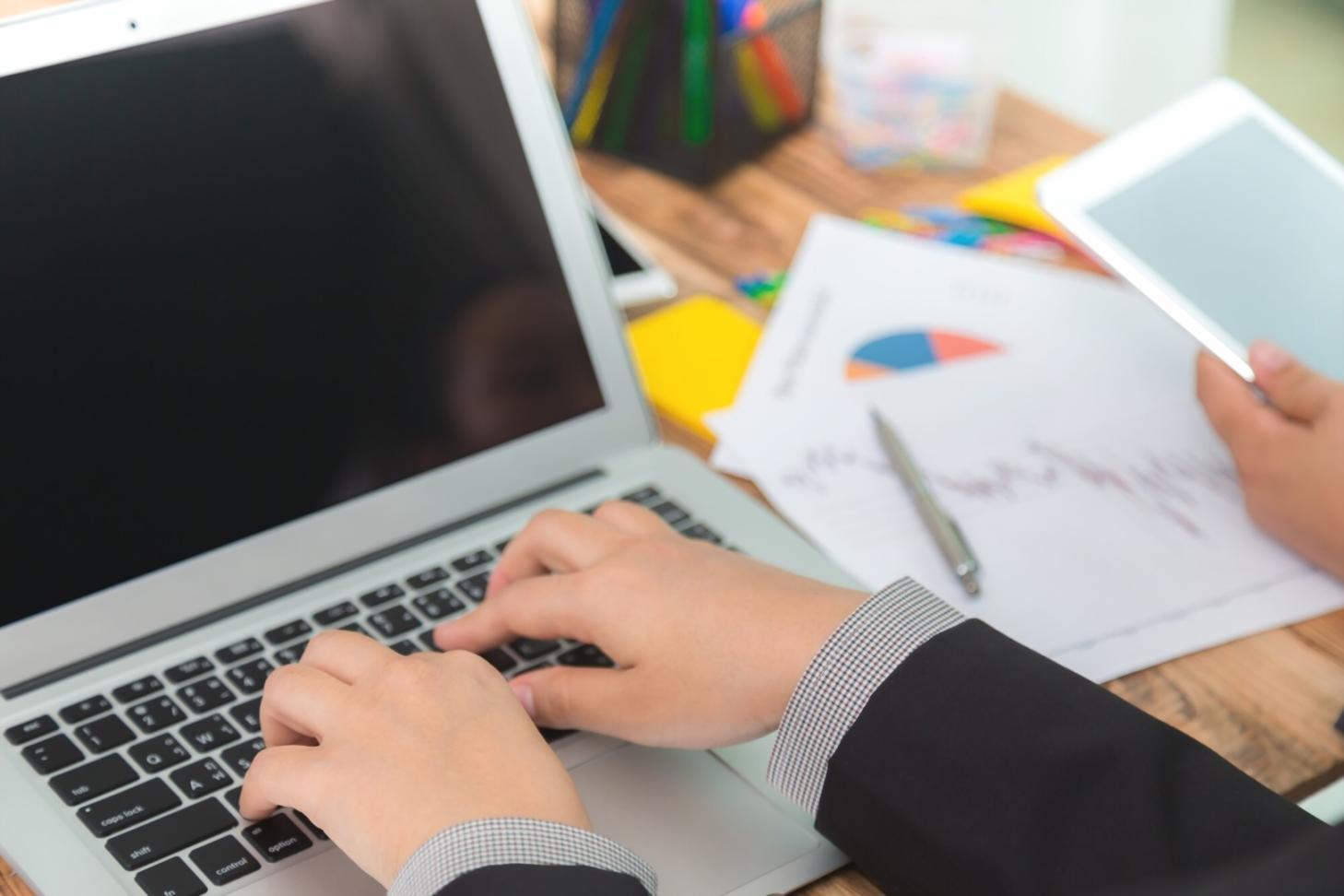 Financial analysis workspace with charts and planning documents
